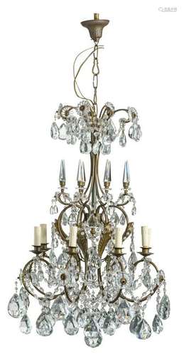 A floral decorated gilt brass chandelier with cut