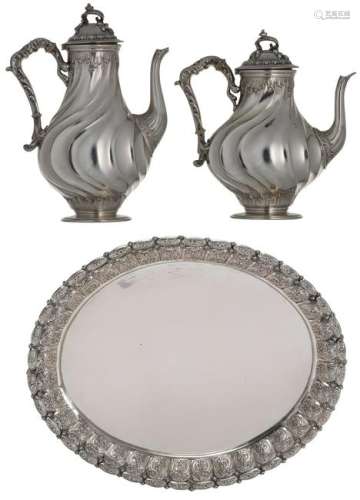 A silver oval richly decorated salver, 800/1000; added