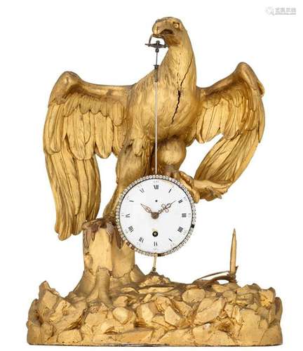 A French gilt wood clock in the shape of an eagle,