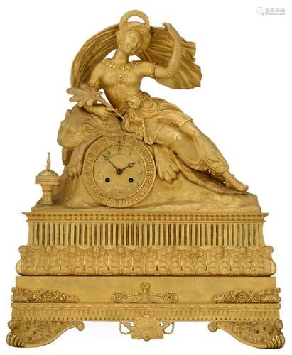 A gilt bronze mantel clock with an Oriental beauty