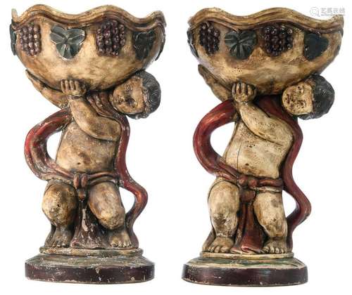 A pair of polychrome oak plant stands with putti, H 76