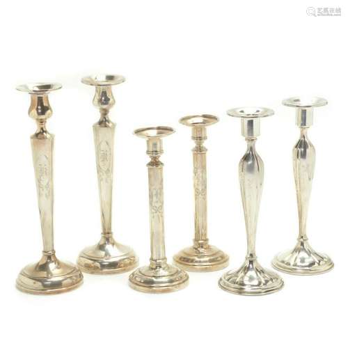Three Pairs of Weighted Sterling Silver Candlesticks.