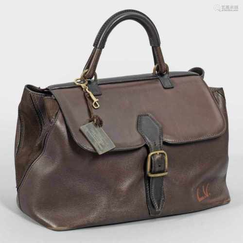 Kleine Vintage Reisetasche von Louis VuittonSchokoladenbraunes glattes Leder mit Wildledereinsätzen.