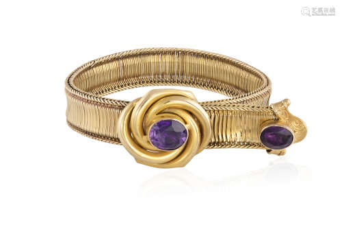 A GOLD AND AMETHYST BRACELET, designed as a belt, both the buckle and terminal set with an oval-