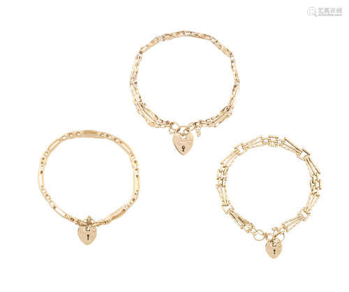THREE GOLD BRICK-LINK BRACELETS, each in 9K gold with heart-shaped padlocks, each with security