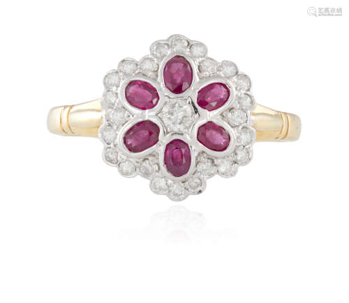 A RUBY AND DIAMOND DRESS RING, composed of oval-shaped rubies within a surround of circular-cut