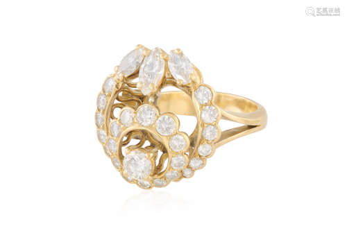 A DIAMOND DRESS RING, set throughout with round brilliant-cut diamonds with three marquise-shaped