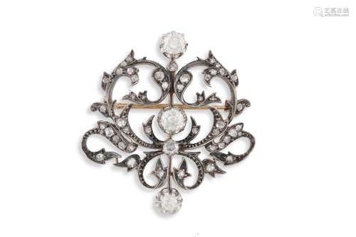 A LATE 19TH CENTURY DIAMOND BROOCHOf openwork scrolling design, set throughout with old cushion
