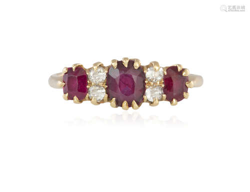 A RUBY AND DIAMOND RING, composed of three graduated cushion-shaped rubies highlighted with old