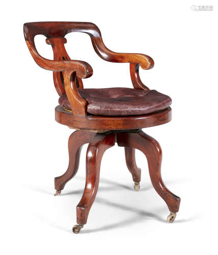 A VICTORIAN MAHOGANY AND BUTTON UPHOLSTERED SWIVEL CHAIR, c.1840, with pierced vase shaped splat and