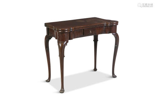 AN GEORGE III MAHOGANY FOLDING-TOP CARD TABLE, the shaped rectangular top opening to reveal a