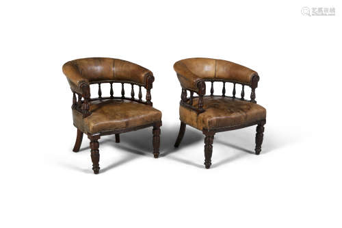 A PAIR OF MAHOGANY AND TAN LEATHER TUB BACK ARMCHAIRS, 19th century, each curved back rail on a rail