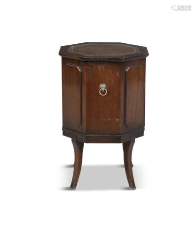 A SMALL OCTAGONAL COMMODE, 19th century with shaped top and panelled sides, fitted with brass ring