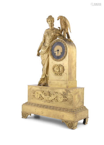 A FRENCH EMPIRE PERIOD GILT BRONZE FIGURAL MANTLE CLOCK, featuring Ganymede by the domed clock case,