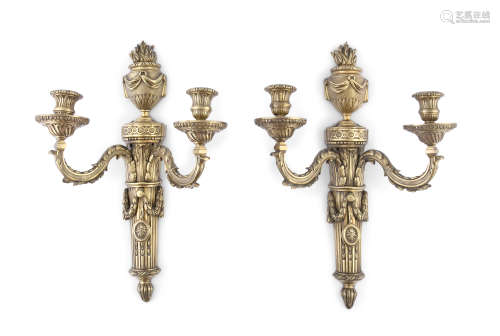 A PAIR OF FRENCH CAST BRASS WALL SCONCES, in Louis seize style, each with classical back plate and