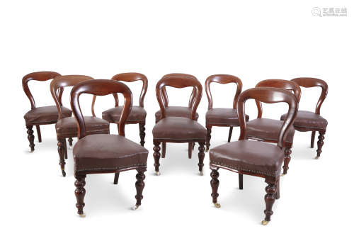 A SET OF NINE VICTORIAN MAHOGANY FRAMED BALLOON BACK DINING CHAIRS, with padded seats and raised