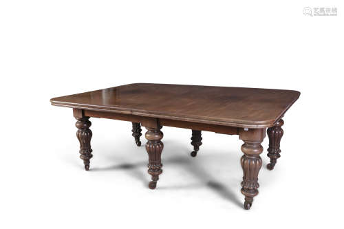 A VICTORIAN MAHOGANY RECTANGULAR TELESCOPIC EXTENDING DINING TABLE, with moulded rim and raised on