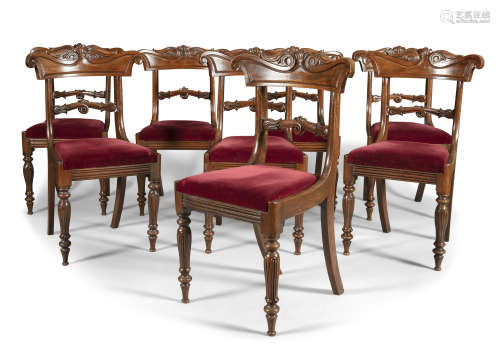 A SET OF EIGHT WILLIAM IV MAHOGNAY FRAMED DINING CHAIRS, with leaf carved top rail and cross bar,