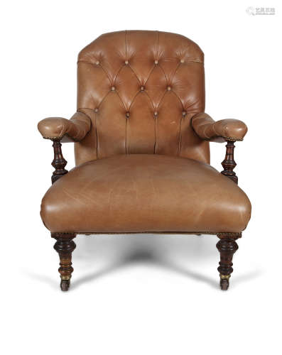 A VICTORIAN MAHOGANY FRAMED AND TAN LEATHER ARMCHAIR, the rectangular back with button back