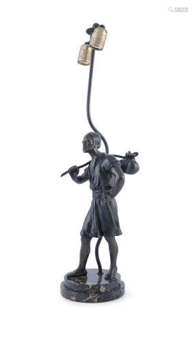 AN ITALIAN BRONZE FIGURAL TABLE LAMP, circa 1900, modelled as a standing male figure with a knapsack