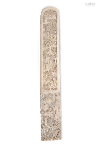 A LARGE CHINESE CARVED IVORY PAPERKNIFE, 19th century, finely decorated with figures in a pagoda
