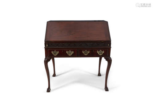 A GEORGE III MAHOGANY SLOPE FRONT BUREAU, the sloped top opening to reveal a fitted interior,