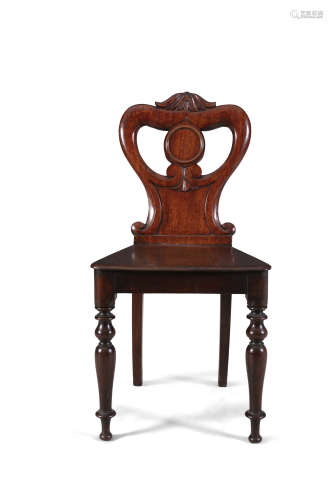 A WILLIAM IV MAHOGANY HALL CHAIR, with pierced scrollwork back and solid panel seat, on turned