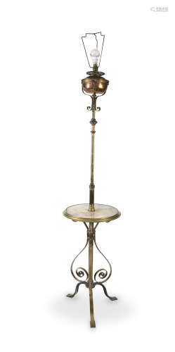 A BRASS FRAMED STANDARD LAMP, with circular marble platform. 160cm high