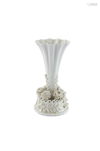 A BELLEEK TRUMPET SHAPED VASE, third period (1926 - 46), of tapering form, the base applied with