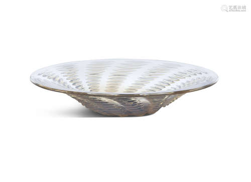 A FRENCH LALIQUE OPALESCENT GLASS DISH, of circular form, the interior decorated with rows of