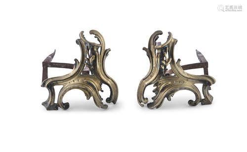 A LOUIS QUINZE STYLE PAIR OF GILT BRASS CHENETS, of cast scroll form