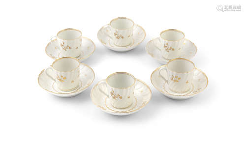 A SET OF SIX COALPORT CHINA COFFEE CANS AND SAUCERS, with moulded spiral fluted sides, the off-white