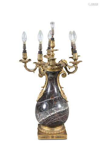 A MARBLE AND ORMOLU CANDELABRUM of circular baulster form with five scroll branches and raised on