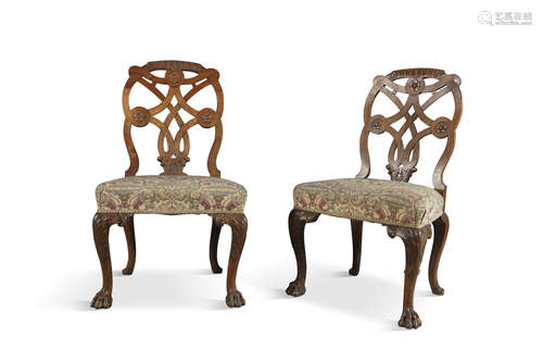 A PAIR OF 19TH CENTURY SIDE CHAIRS IN THE GEORGE II STYLE, the carved top rails mounted on a pierced