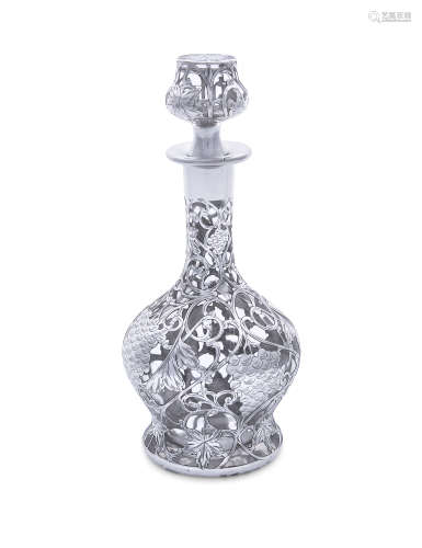 A 19TH CENTURY SILVER OVERLAID CLEAR GLASS DECANTER AND STOPPER, of baluster form, the pierced and