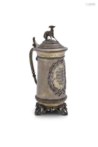 A GERMAN GILT METAL PRESENTATION TANKARD AND COVER, 19th century, .800 standard, surmounted with a