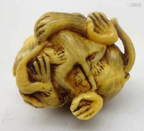 Japanese Meiji ivory Okimono carved as a family of Monkeys, signature to base,