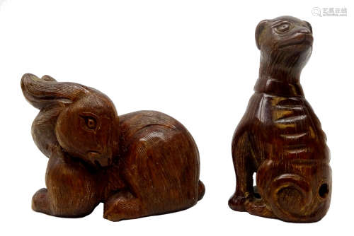 Two Japanese Meiji fruit wood Netsukes carved as a seated Dog with signature and Rabbit H5cm (2)