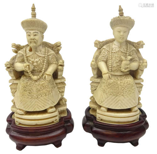 Pair 19th century Chinese ivory figures of an Emperor and Empress seated on thrones,