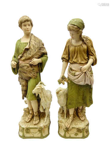 Pair of large Royal Dux figures of shepherd and shepherdess stood besides a goat and sheep on