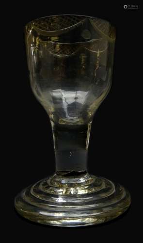 Late 18th century firing glass, ogee bowl with engraved rim and basal flutes on terraced foot H9.