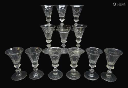 Matched set of twelve 19th century wine glasses, conical faceted bowls on knopped stems, H11.