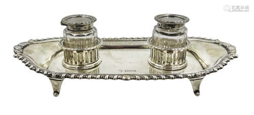 Silver inkstand of shaped rectangular form, gadroon border,