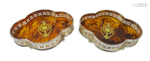 Pair quatrefoil simulated tortoise shell bottle coasters with silver-plate gallery and brass inlay,