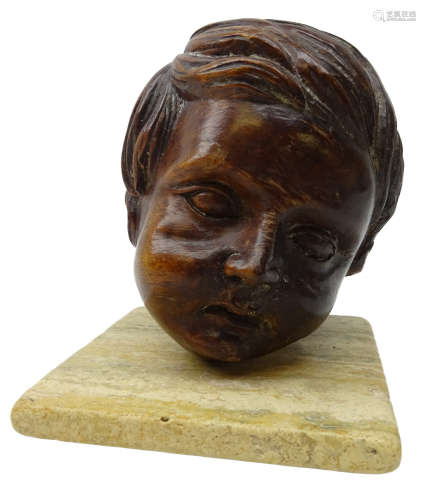 19th century French carved mahogany head of a young boy on stone plinth,