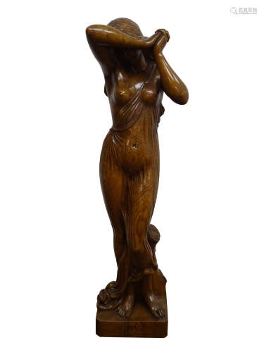 Large carved figured oak model of a diaphanously draped young woman,