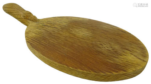 'Mouseman' oak oval cheese board by Robert Thompson of Kilburn with carved mouse signature,