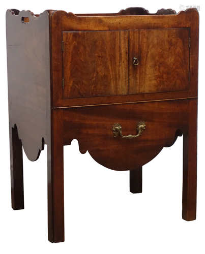 George lll mahogany bedside cupboard with gallery top and two doors above a sliding drawer,