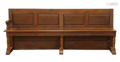 Large 19th century oak church pew, four panel back, plank seat with end arm rest,