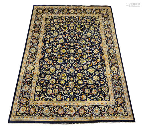 Persian Kashan rug carpet, blue ground field with scrolling foliate and stylised flower heads,